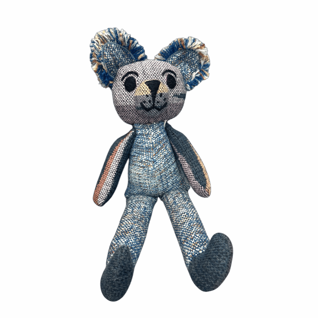 Indigo Scout Teddy is a handwoven alpaca and merino teddy bear in soothing blues, ready for cuddles and adventure by Ashculme Textiles.