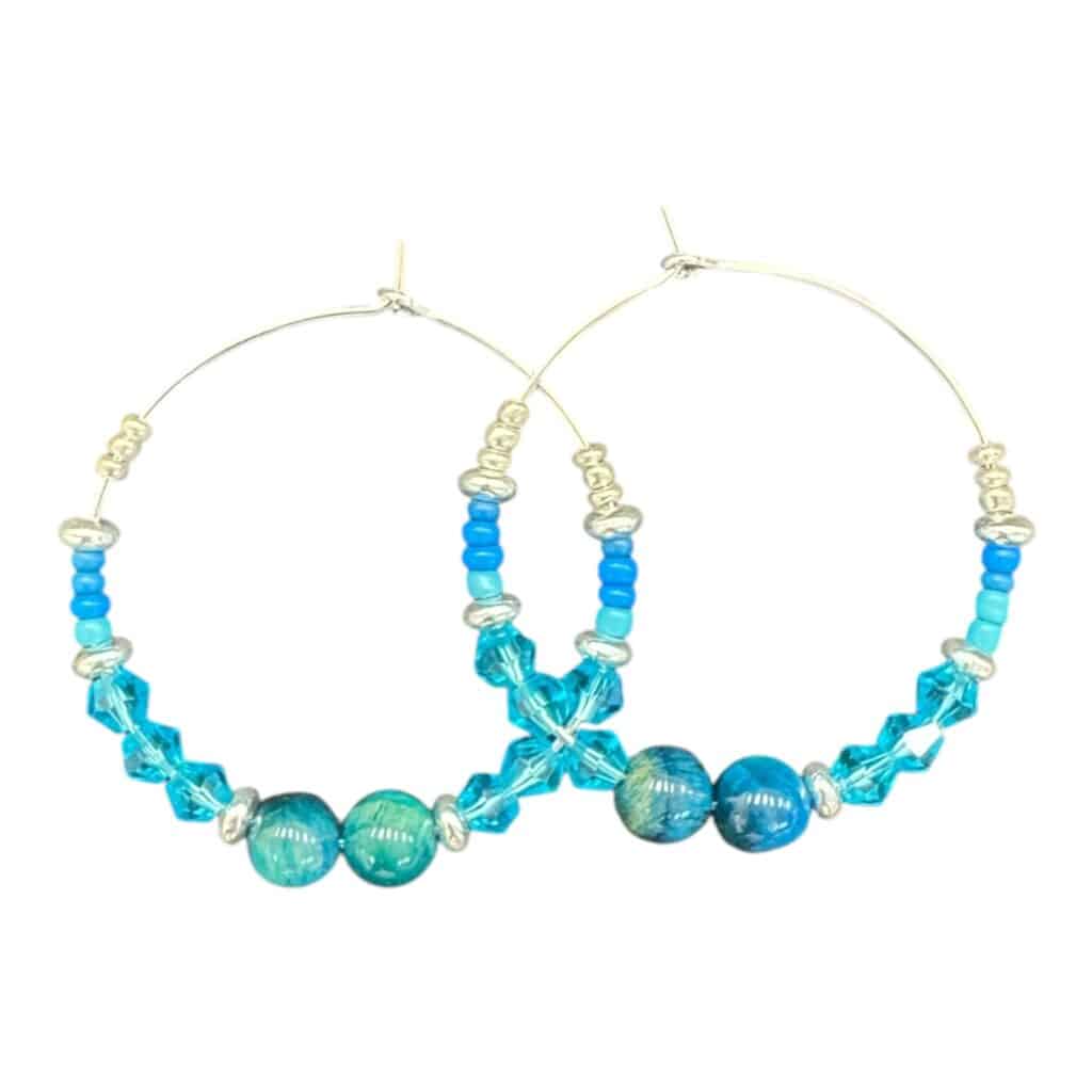 Aqua Sparkle Hoops by Art in Stone — handmade hoops with turquoise crystals and ocean glass beads. Bright, fresh, and unique!