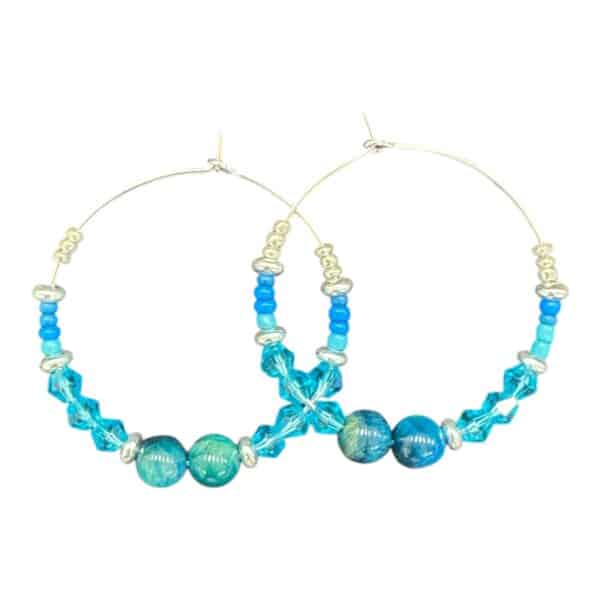 Aqua Sparkle Hoops by Art in Stone — handmade hoops with turquoise crystals and ocean glass beads. Bright, fresh, and unique!