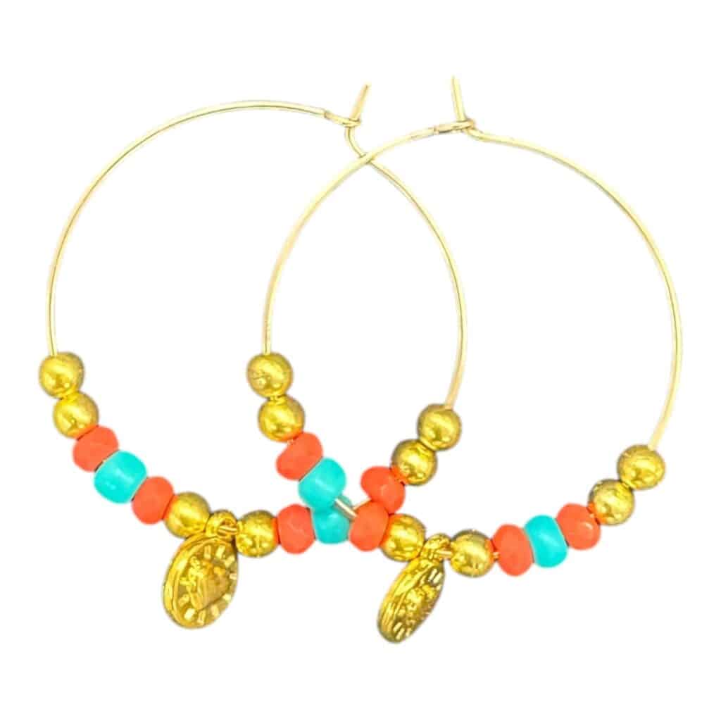 Sunset Fiesta Hoops by Art in Stone — handmade hoops with orange and turquoise beads, gold accents, and medallion charm. One of a kind!