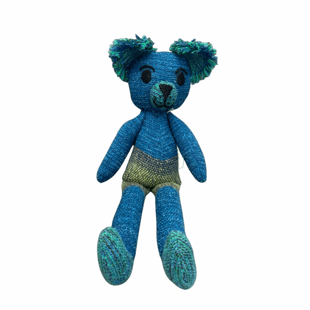 Ocean Sprout Teddy is a bold blue-green teddy bear handmade from alpaca and merino wool, full of personality and softness by Ashculme Textiles.