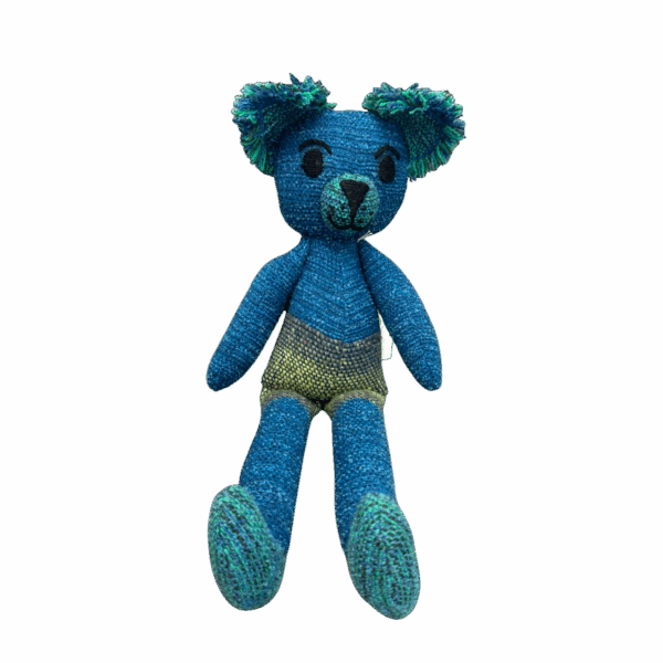 Ocean Sprout Teddy is a bold blue-green teddy bear handmade from alpaca and merino wool, full of personality and softness by Ashculme Textiles.