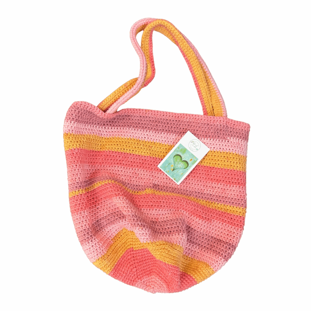 Pink Lemonade Tote by Dinah Lindon: A zesty, colourful hand-crocheted bag bursting with sunny vibes, now available at yellowhouseart!