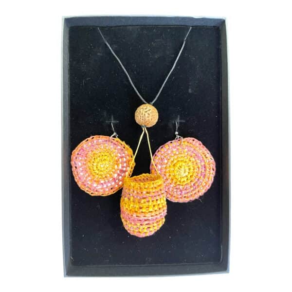 Desert Sunset Set by Gomeroi artist Debbie Wood. A bright raffia basket necklace with matching earrings in sunset pinks and yellow.