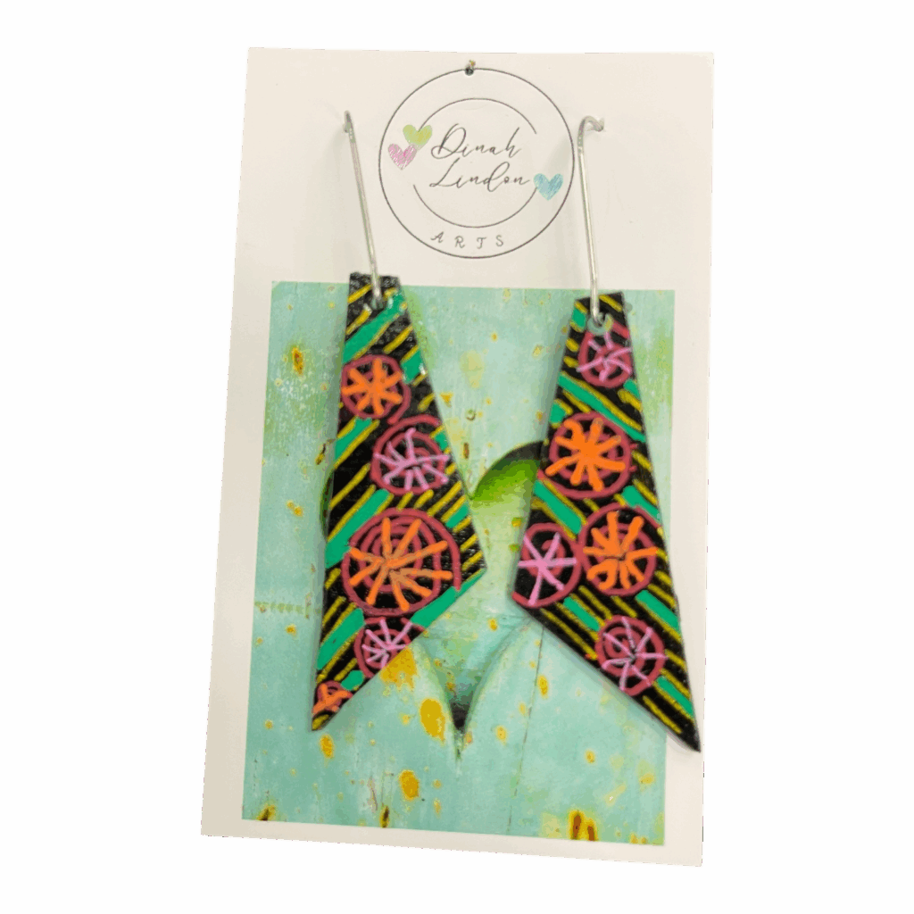 Carnival Whirl Arrows – black arrow earrings with neon floral bursts and stripe detailing, handpainted and gloss sealed.