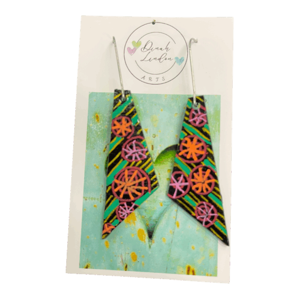 Carnival Whirl Arrows – black arrow earrings with neon floral bursts and stripe detailing, handpainted and gloss sealed.