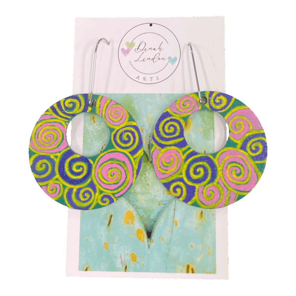 Neon Spiral Disco Hoops – bold round earrings with handpainted spirals in pink, yellow, and purple. by Dinah Lindon Artist.