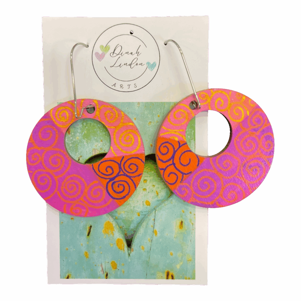 Sunset Spiral Hoops – handpainted hoops in pink and orange with swirling details and high-gloss finish.