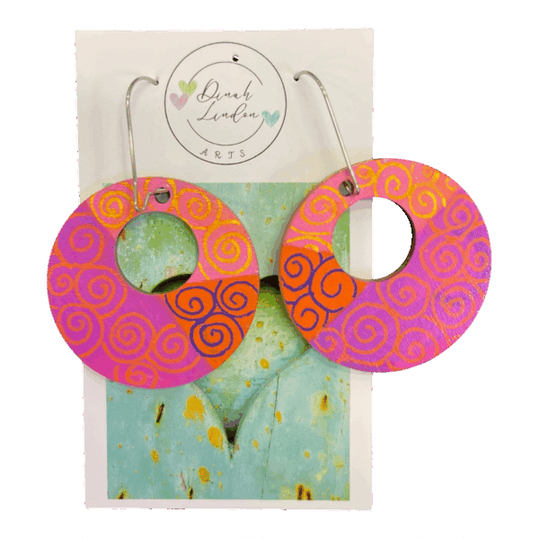 Sunset Spiral Hoops – handpainted hoops in pink and orange with swirling details and high-gloss finish.