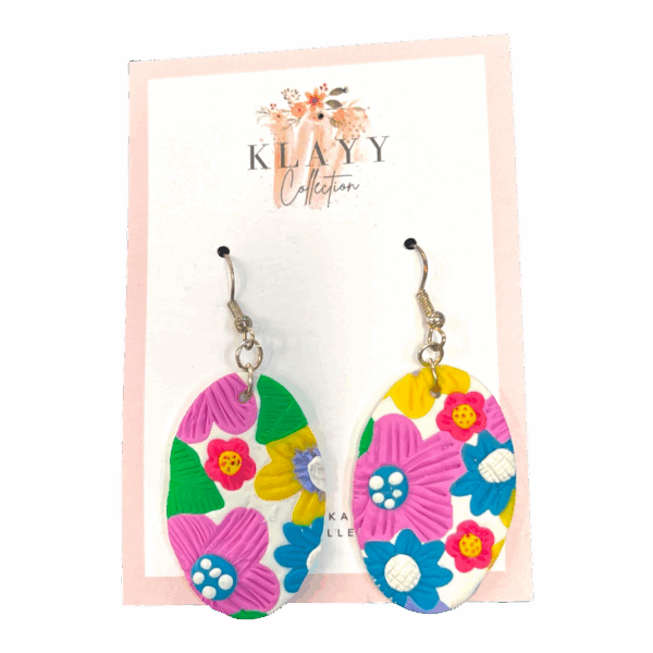 Petal Pop earrings are bold, bright ovals bursting with colourful floral detail. Retro flair meets modern fun. Lightweight and handmade.