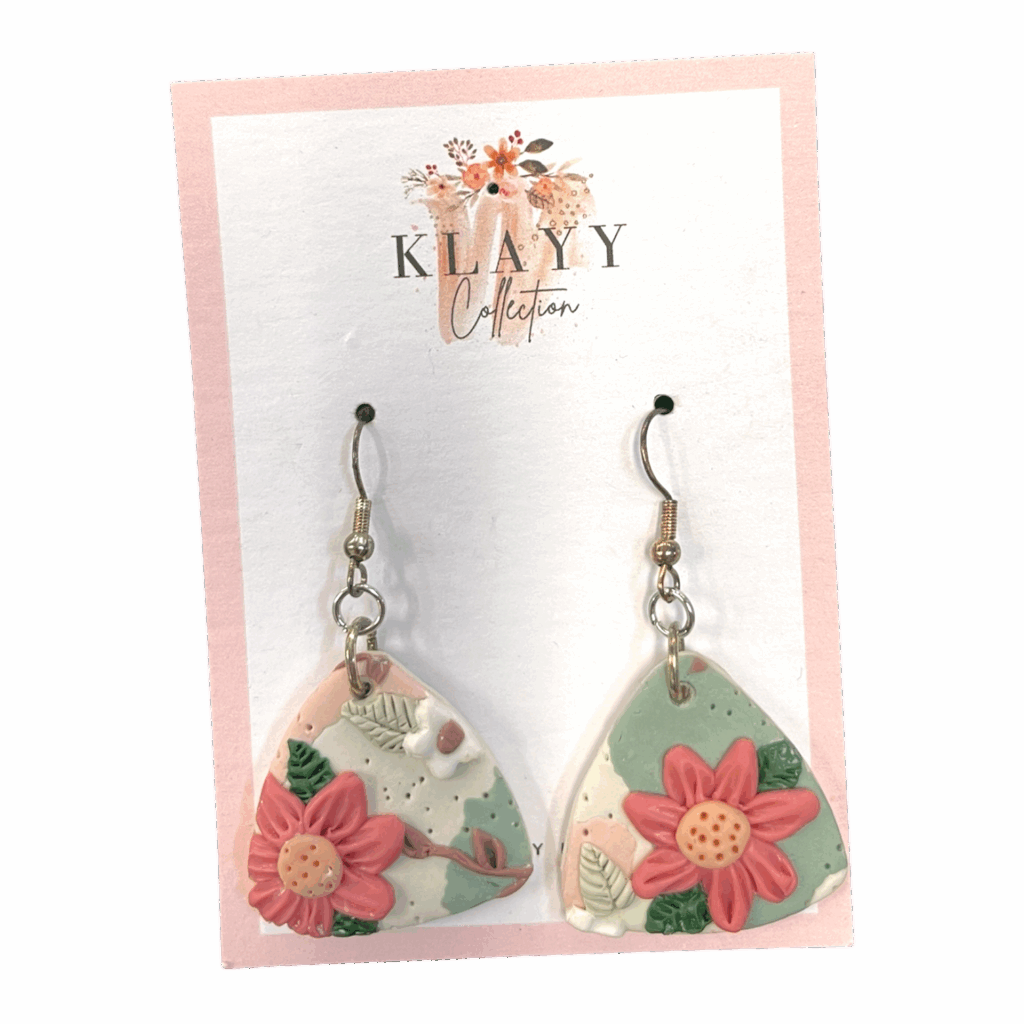 Peach Bloom earrings feature soft blush petals on a marbled sage and peach base. Subtle, floral, and handmade.