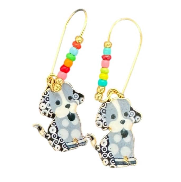 Pepper Pup Dangles by Art in Stone — handmade gold earrings with black and white enamel dog charms and colourful beads for joyful style.