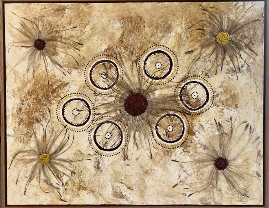 Discover new mixed media works by Gomeroi artist Debbie Wood—woven raffia, emu feathers, and paint unite in stunning cultural storytelling.