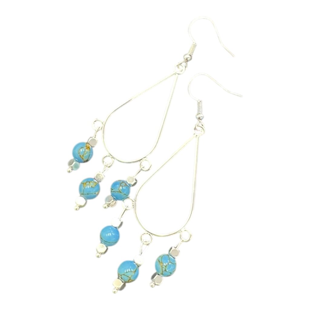 Bright blue teardrop earrings handmade by Art in Stone — the Blue Lagoon Drops capture the sparkle of sunshine on tropical water.