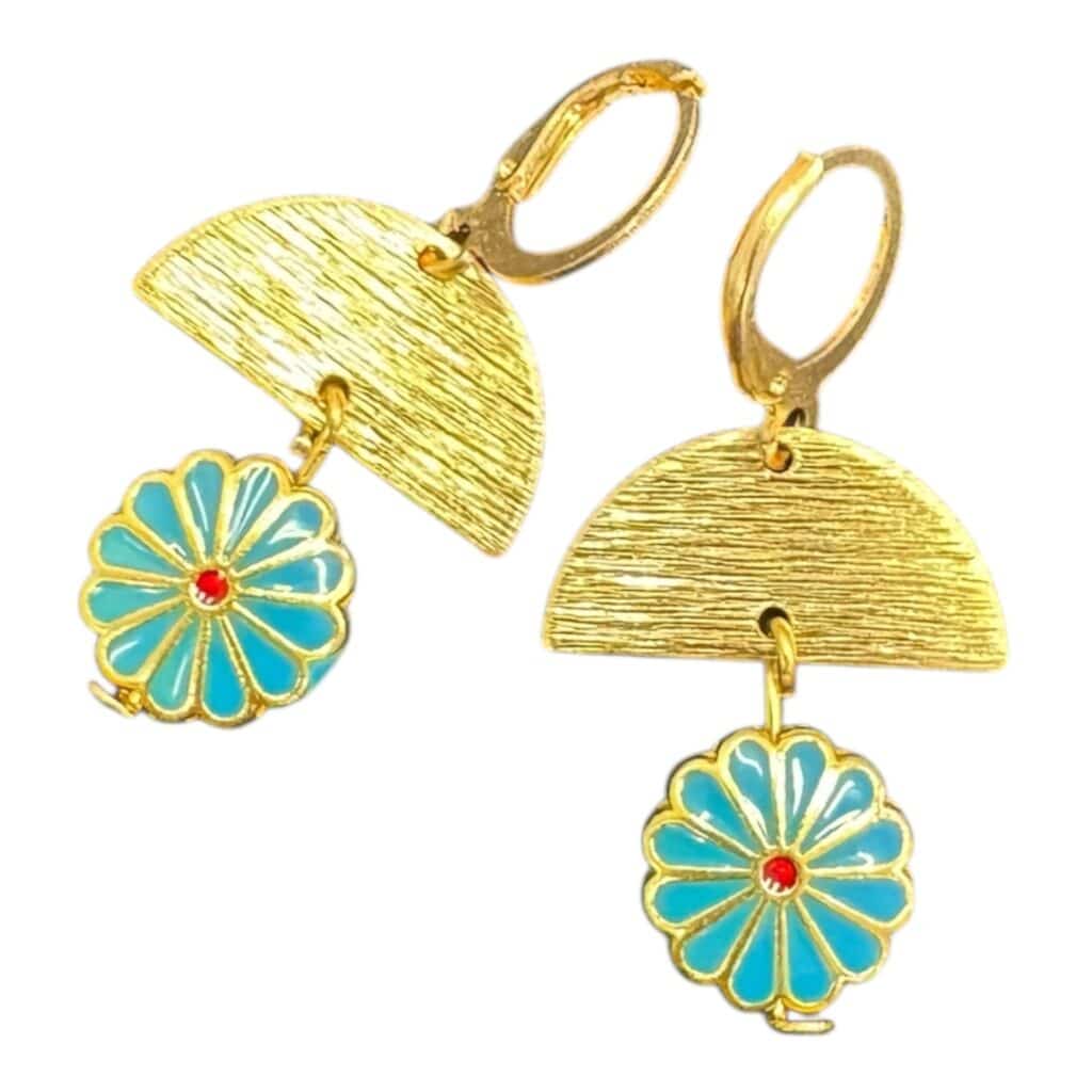 Turn up the sunshine with Blue Skies Daisy Drops — turquoise enamel daisies on textured gold for bold, breezy fun.