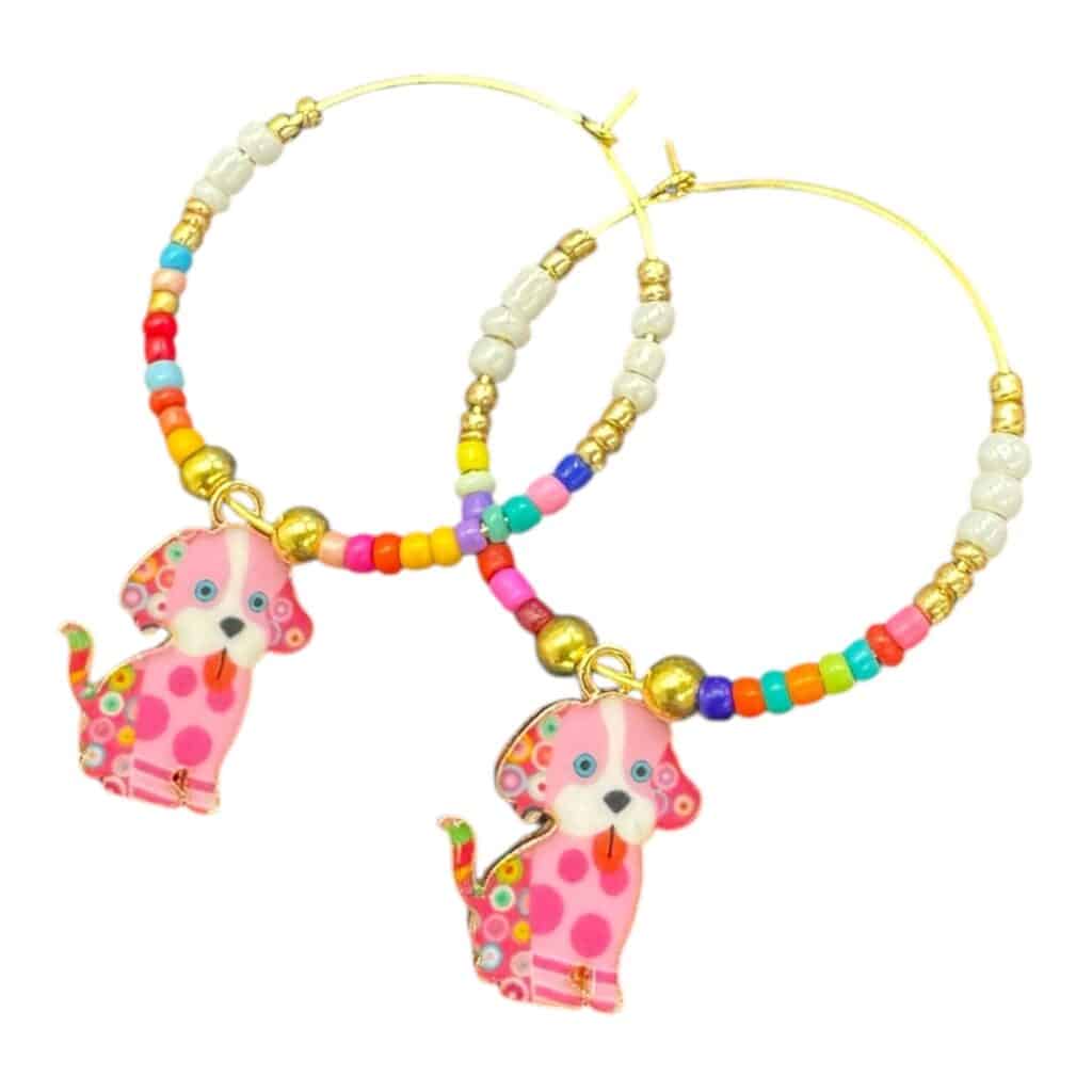 Poppy Pup Hoops by Art in Stone — handmade gold hoop earrings with pink enamel puppy charms and colourful beads for playful, fun style.